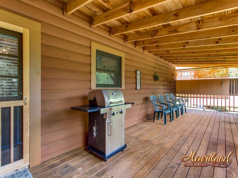 Gas grill on the back deck of this 2 bedroom cabin rental in Pigeon Forge